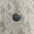Brown and blue stripy small badge