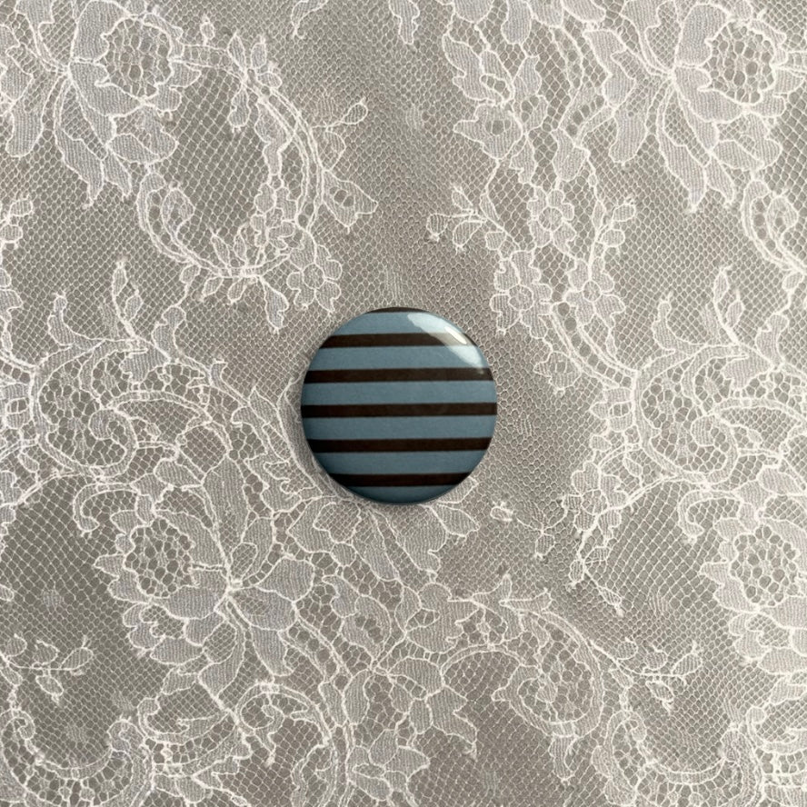 Brown and blue stripy small badge
